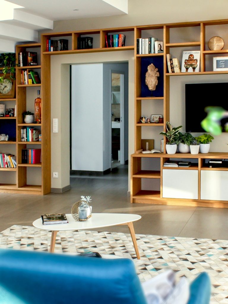 Cozy small living room with space-saving furniture and light color palette