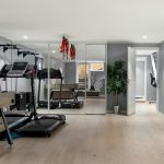 Budget-friendly home gym setup with resistance bands, dumbbells, and a foldable exercise mat