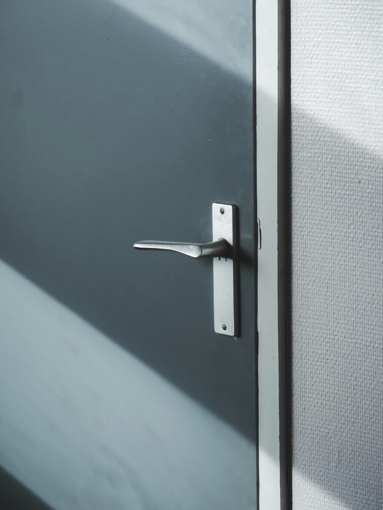 Modern door handle upgrade on wooden door