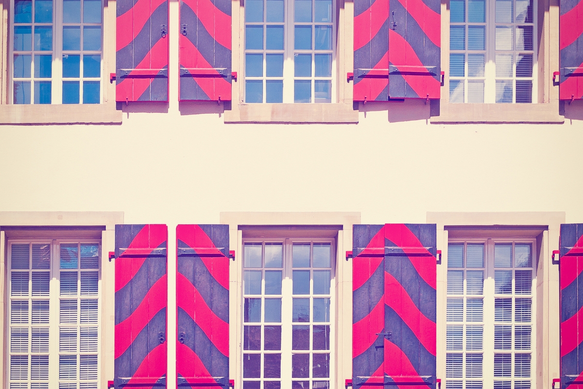 Living room styled for visual balance with furniture and accessories arranged asymmetrically for harmony