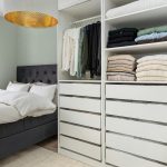 DIY floating shelves installed on a modern living room wall, showcasing minimalist decor, natural wood shelves, and clean contemporary interior design