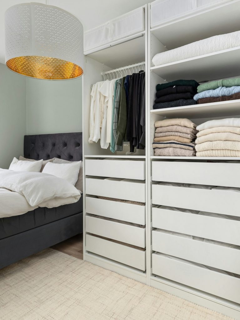 DIY floating shelves installed on a modern living room wall, showcasing minimalist decor, natural wood shelves, and clean contemporary interior design