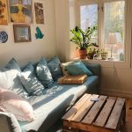 Living room setup after moving into a new home with cozy lighting and simple furniture layout