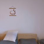 Small guest room decorated with space-saving furniture and neutral colors