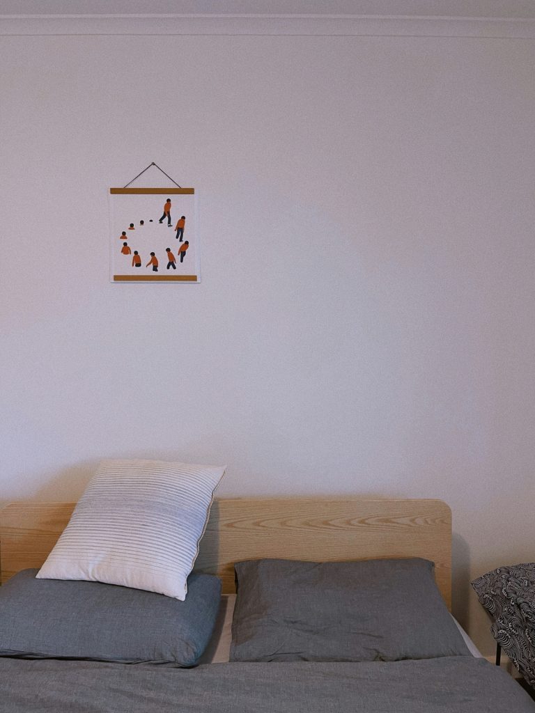 Small guest room decorated with space-saving furniture and neutral colors