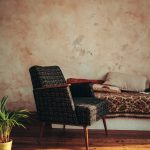 Rustic wooden furniture paired with modern minimalist sofa in a bright, timeless living room interior