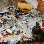 Clutter-free kids’ play corner with organized storage bins, low shelves, cozy rug, and smart lighting, creating a fun and functional play space