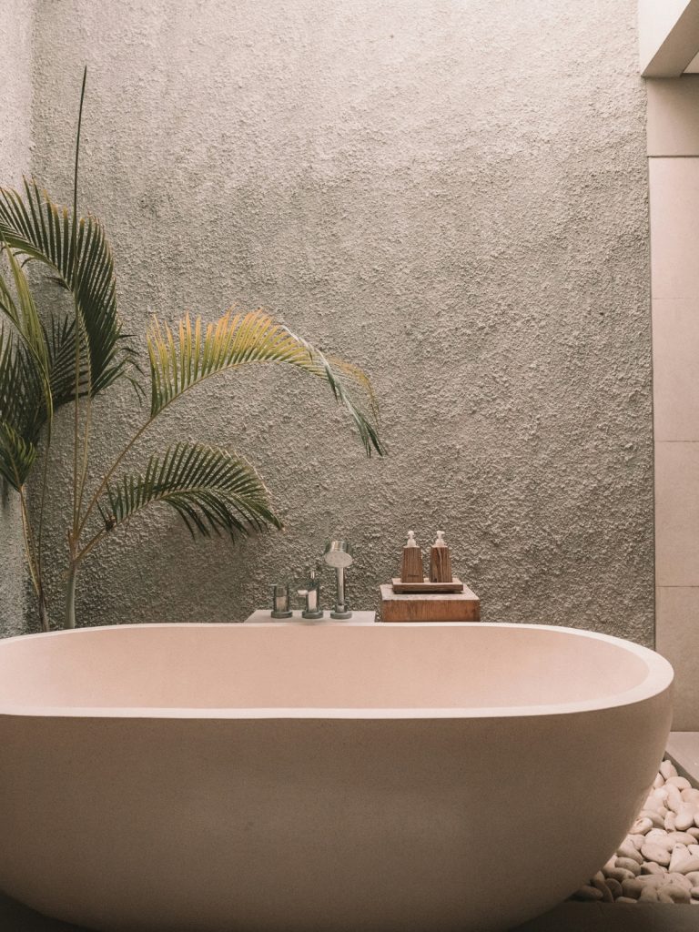 Minimalist spa-inspired bathroom with neutral tones and soft lighting