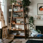 Modern gallery ledge styled with frames and small decorative items in a living room