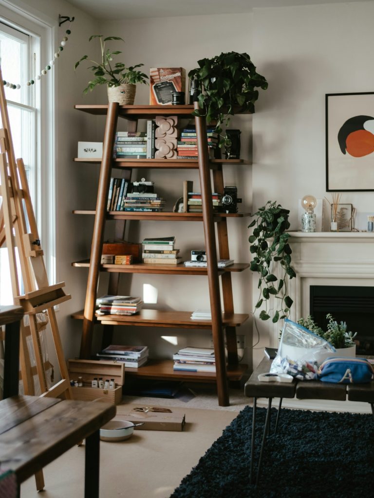 Modern gallery ledge styled with frames and small decorative items in a living room