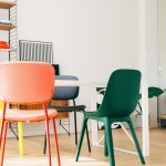 A modern living room featuring a bold statement sofa balanced with minimal furniture and open space for a clean, uncluttered interior design.