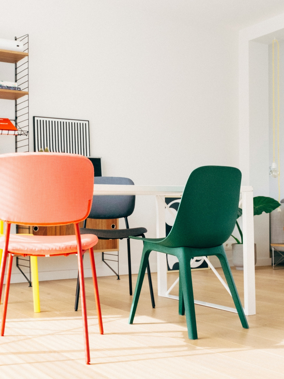 A modern living room featuring a bold statement sofa balanced with minimal furniture and open space for a clean, uncluttered interior design.