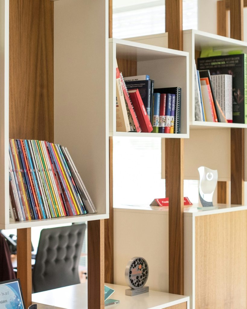 Organized seasonal decor storage bins labeled by season