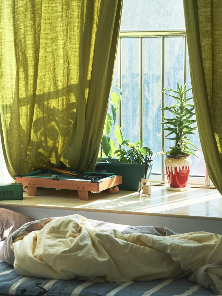 Cozy winter room décor with chunky knit blankets and warm textured fabrics