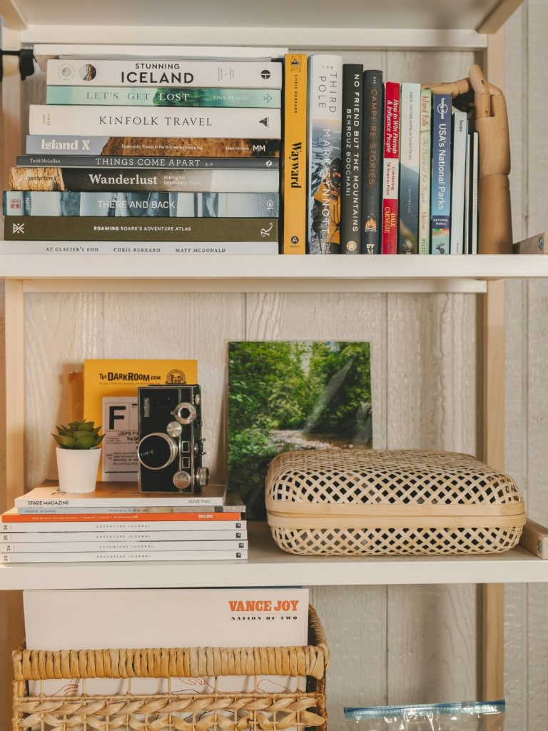 Modern open shelves neatly styled with books, ceramics, and neutral décor