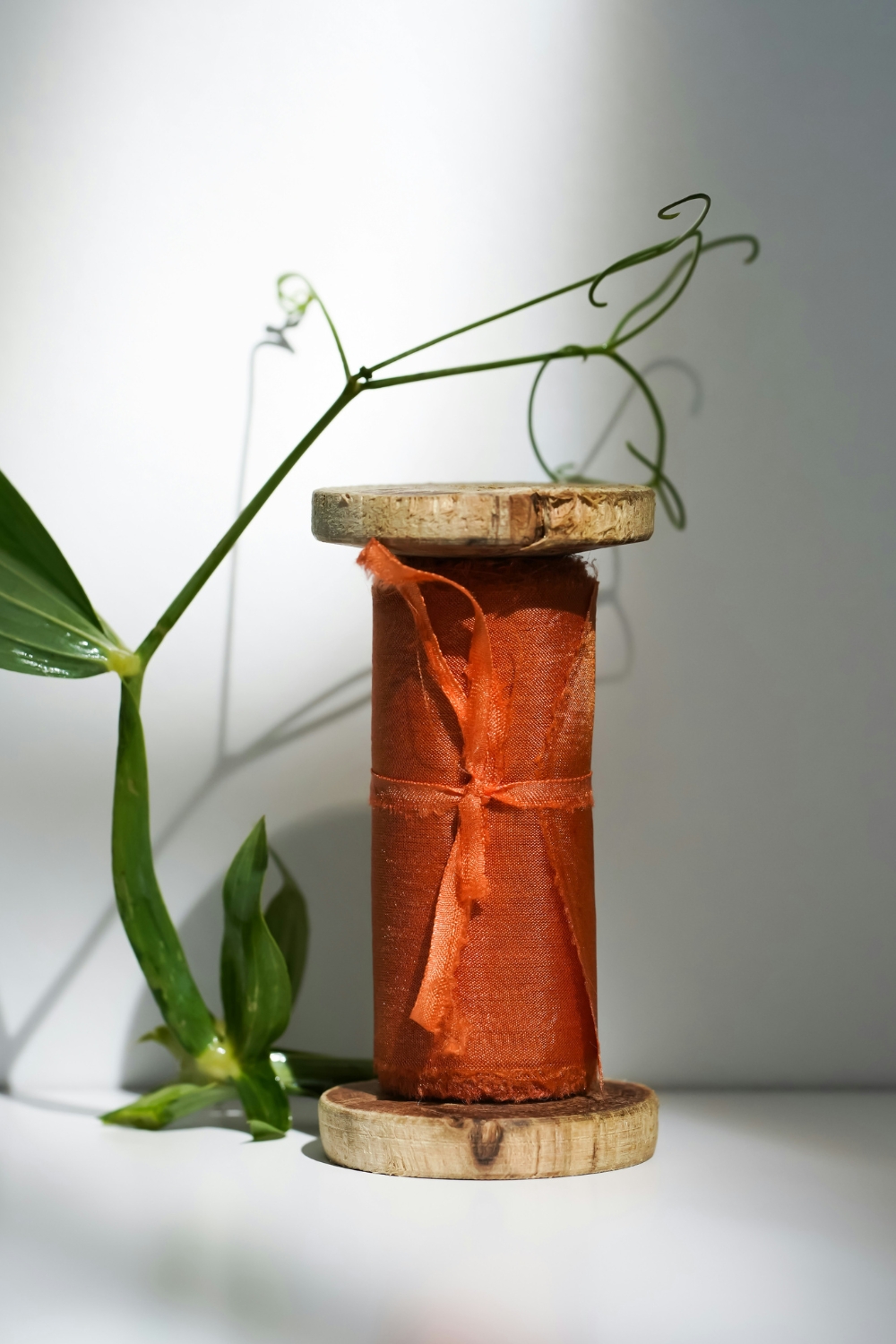 Living room designed with natural materials like wood, stone, and rattan for a calming home