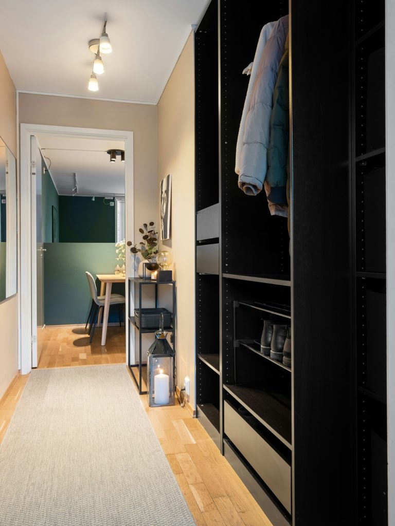 Slim wall-mounted shelves and storage for a narrow hallway