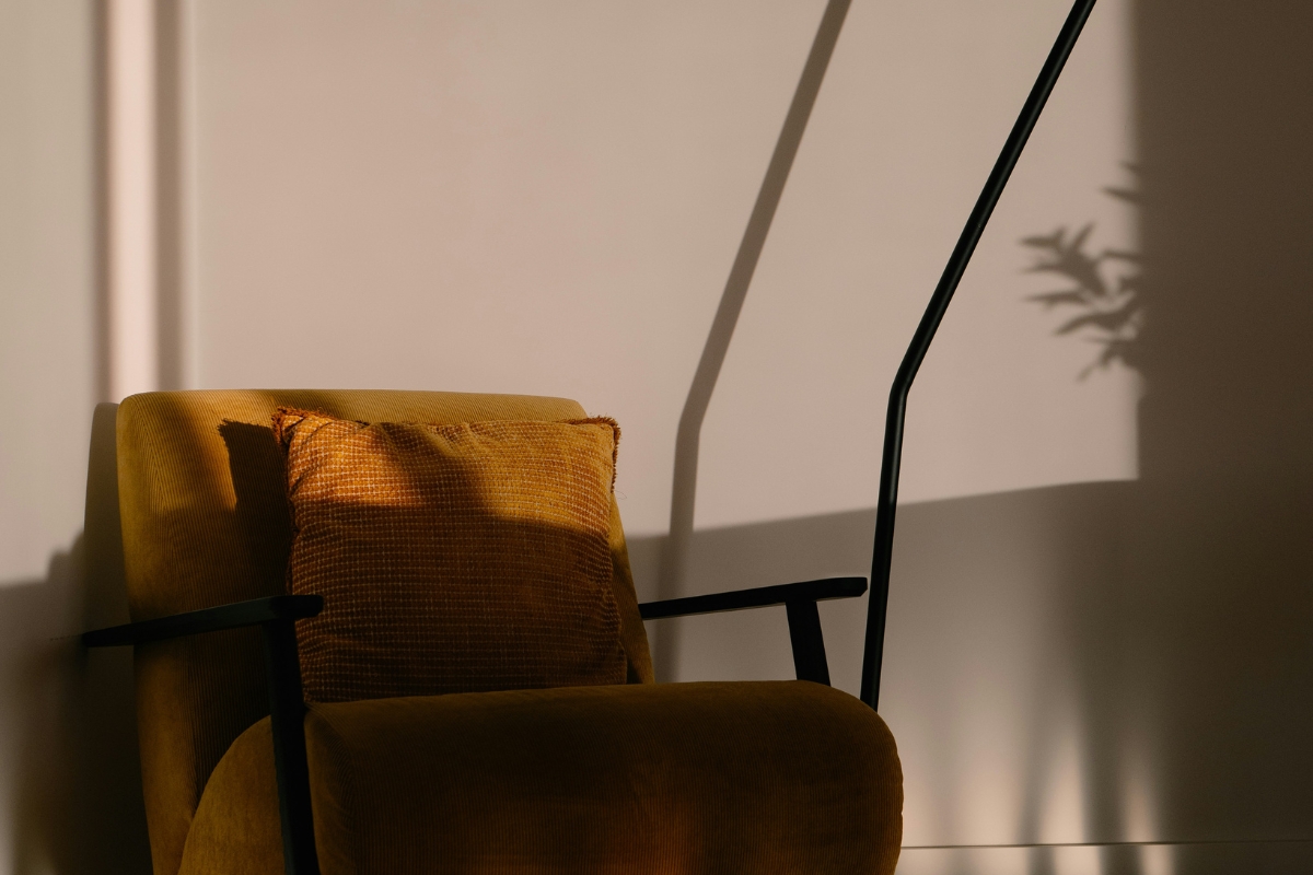 Furniture placement aligned with natural and artificial lighting