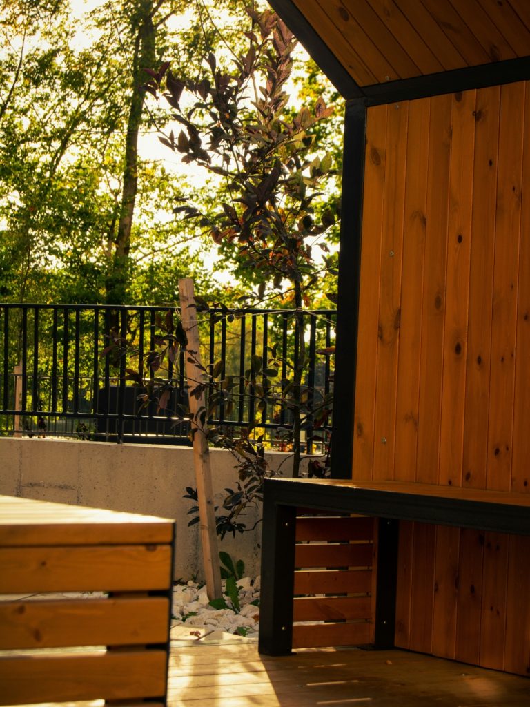 Compact bistro table and chairs arranged for outdoor dining on a small balcony