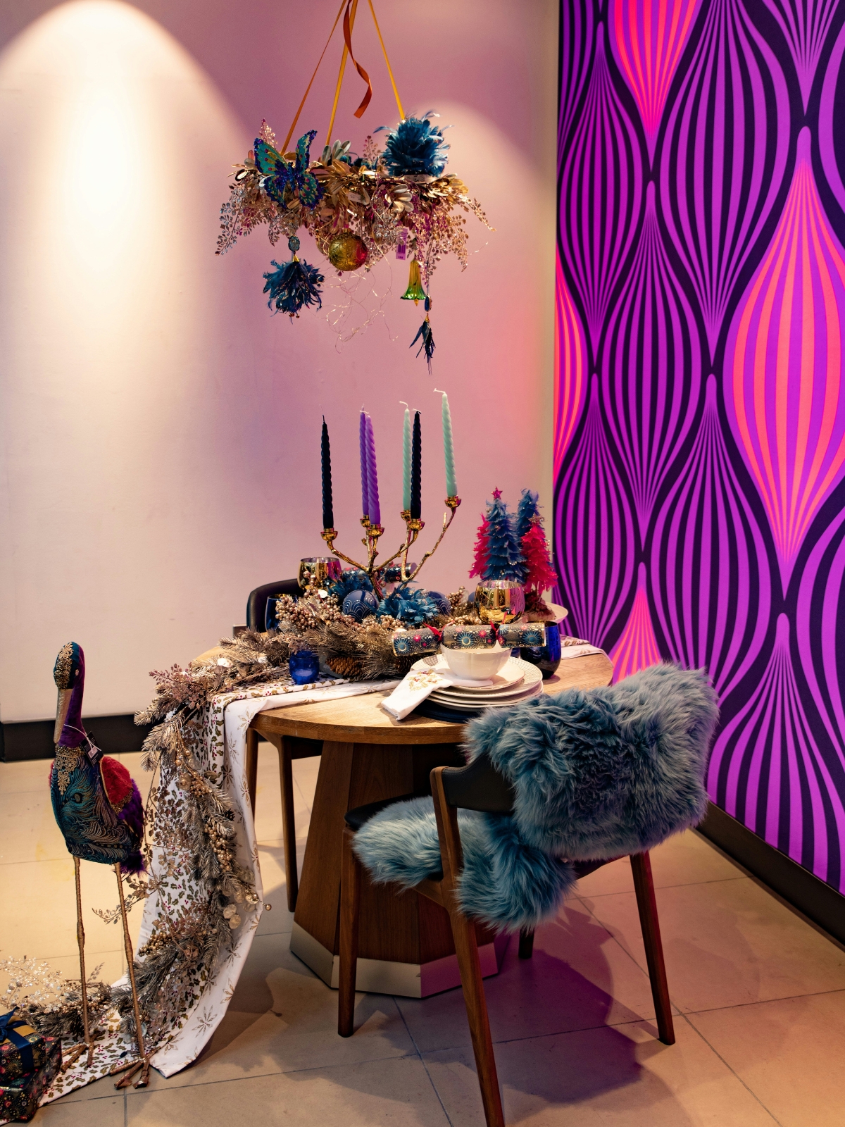 Modern gallery wall with mixed frames and contemporary artwork in a living room