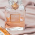 Comparison of room perfume spray and aroma diffuser on a modern living room table.