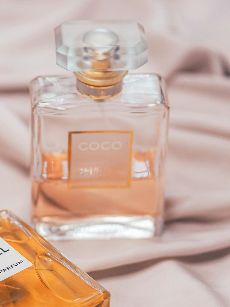 Comparison of room perfume spray and aroma diffuser on a modern living room table.