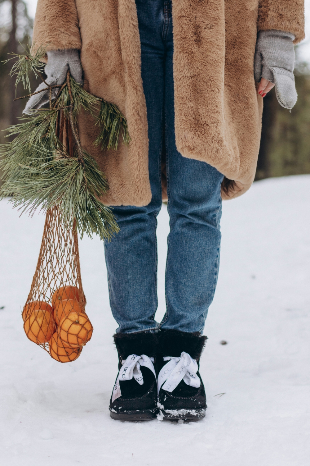 Fireplace styled with subtle seasonal decor and neutral accents