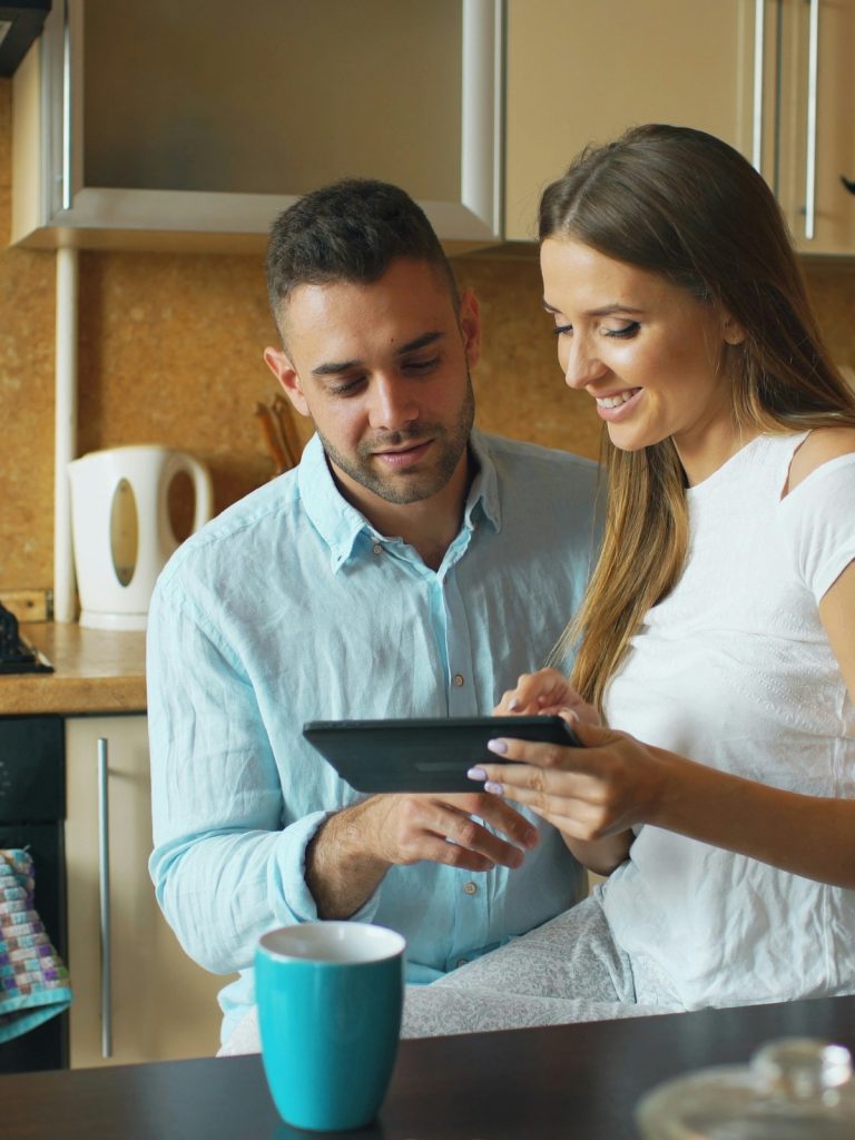 Modern smart home gadgets including smart lighting, thermostat, and voice assistant improving daily convenience in a contemporary home