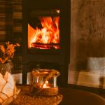 Modern living room with a styled fireplace mantel and cozy decor