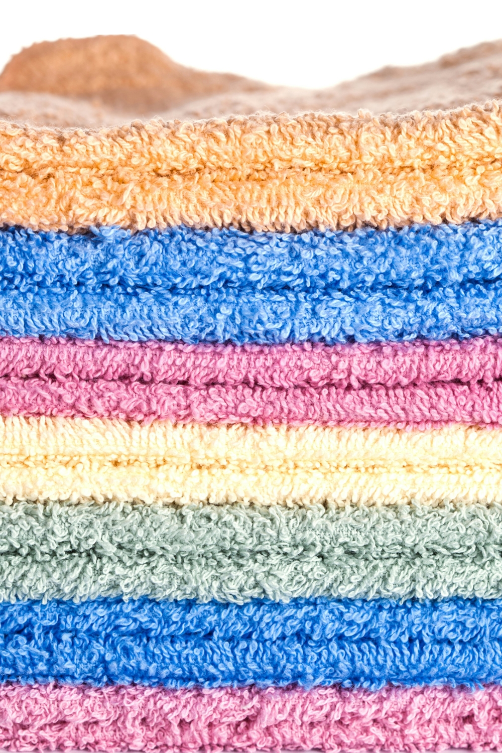 Plush spa towels and bathrobes neatly arranged in a relaxing bathroom