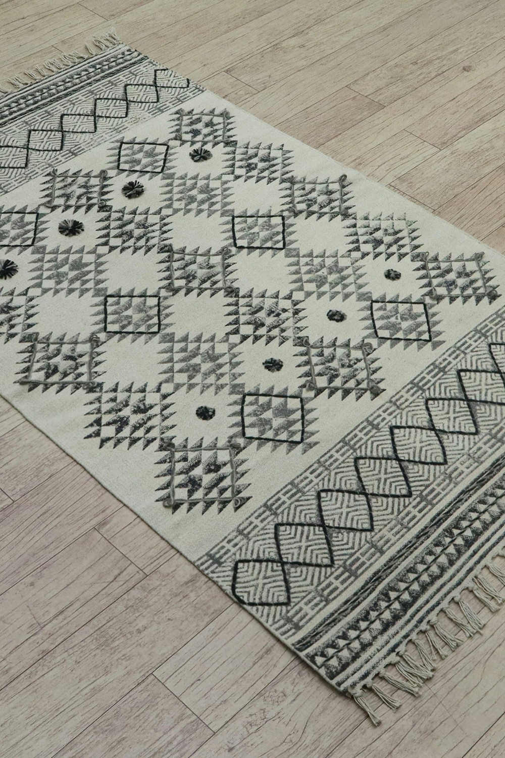 Coordinated rug styles creating visual flow in open-plan living space