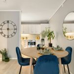 Area rugs used to zone two functional spaces in one room, separating living and workspace areas