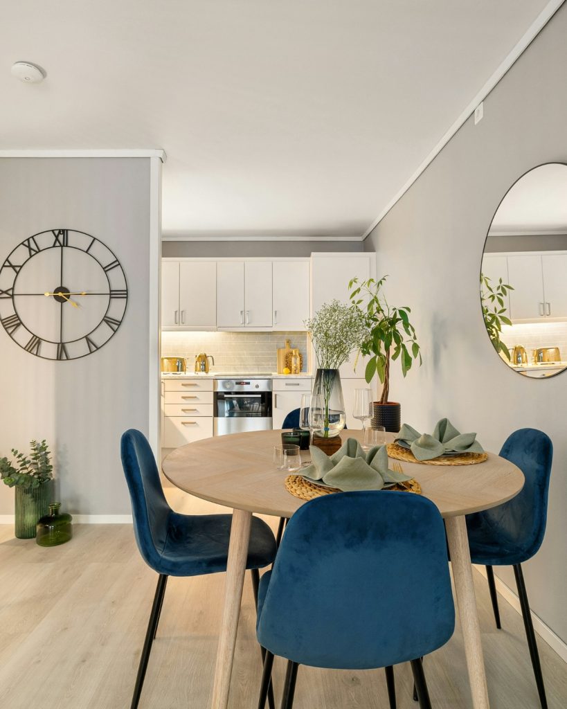 Area rugs used to zone two functional spaces in one room, separating living and workspace areas