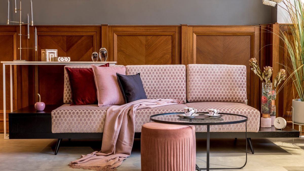 Curved modern sofa in neutral living room showing 2026 furniture trend