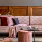 Curved modern sofa in neutral living room showing 2026 furniture trend