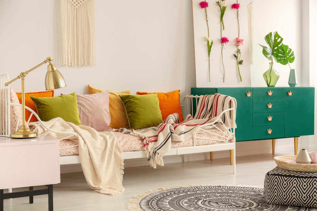 Bold statement sofa anchored with neutral walls and coordinated rug