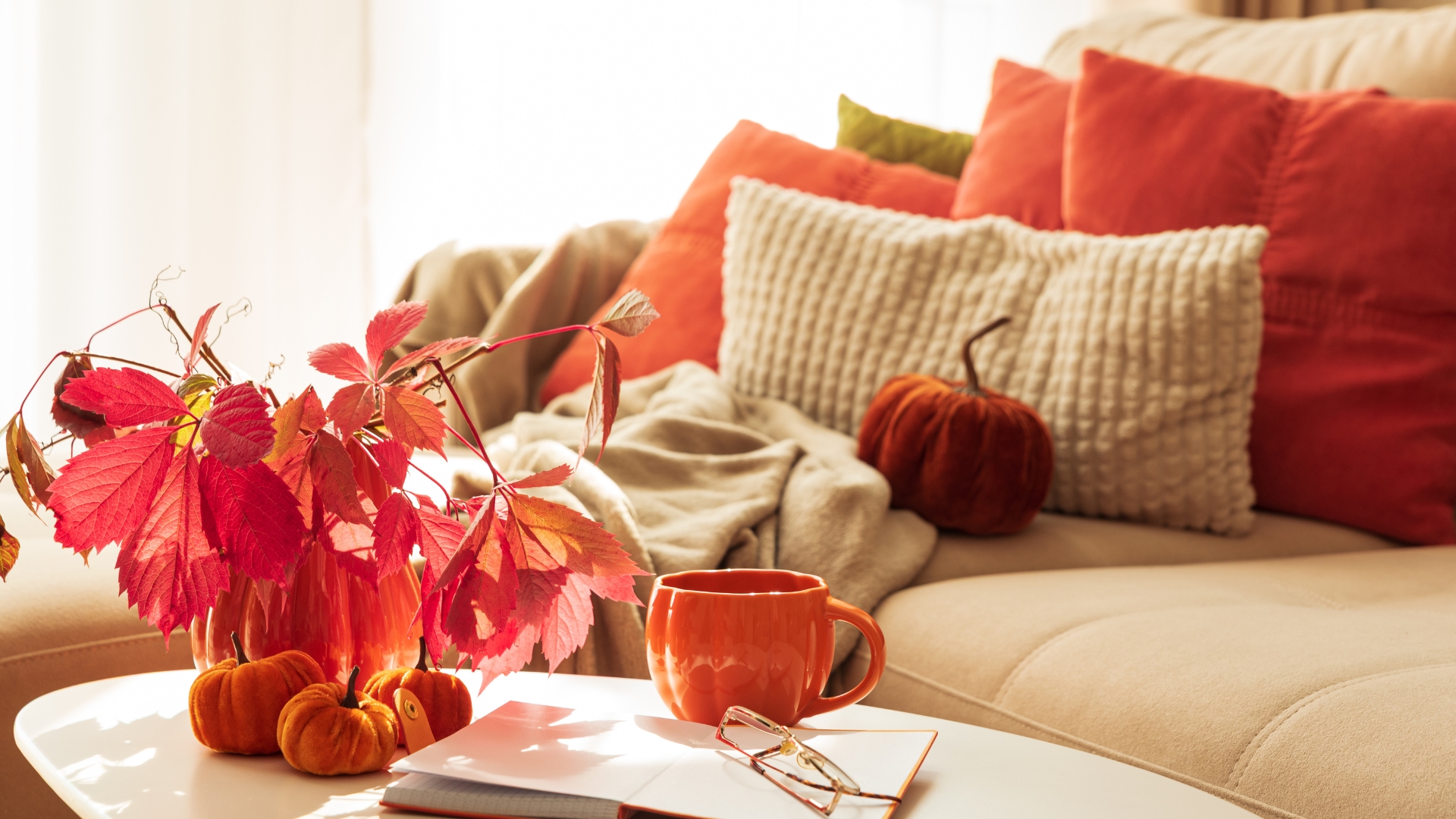 Cozy living room with autumn-inspired warm colors and fall décor