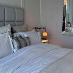 Cozy bedroom with soft textures and earthy tones inspired by 2026 bedroom trends