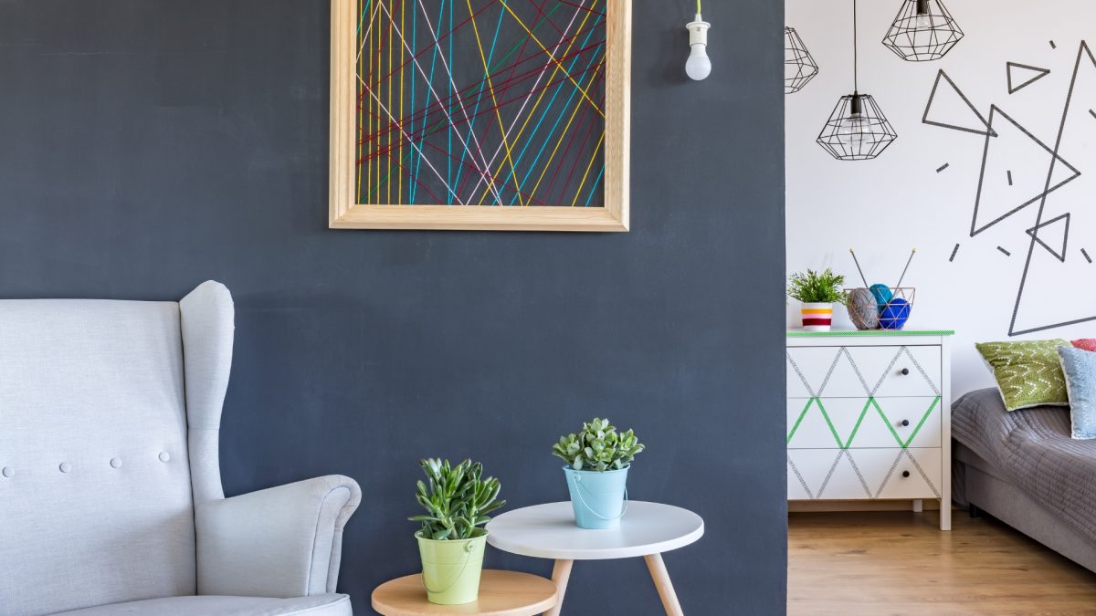 Vertical wood slat paneling in modern living room wall design 2026