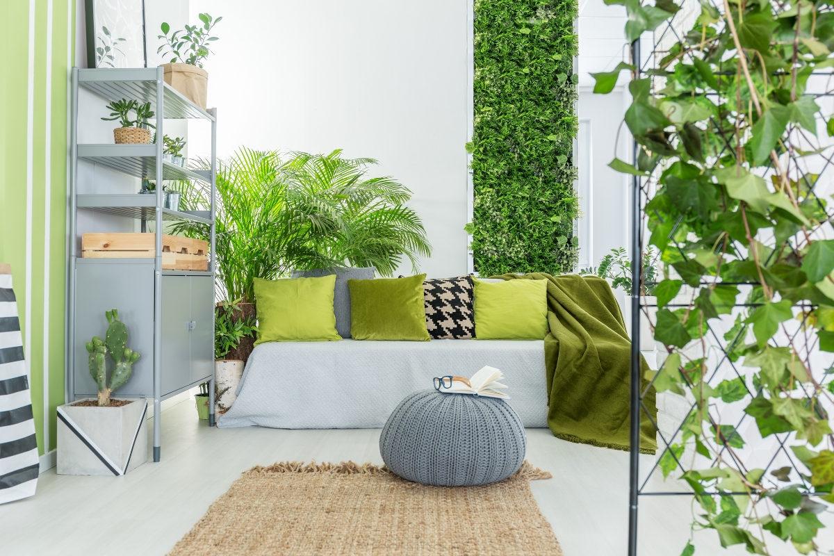 Living room styled with real greenery and houseplants for a fresh spring look