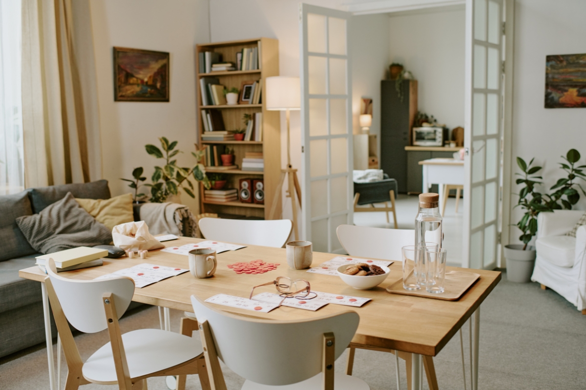 Small dining room with compact social layout featuring round table and bench seating