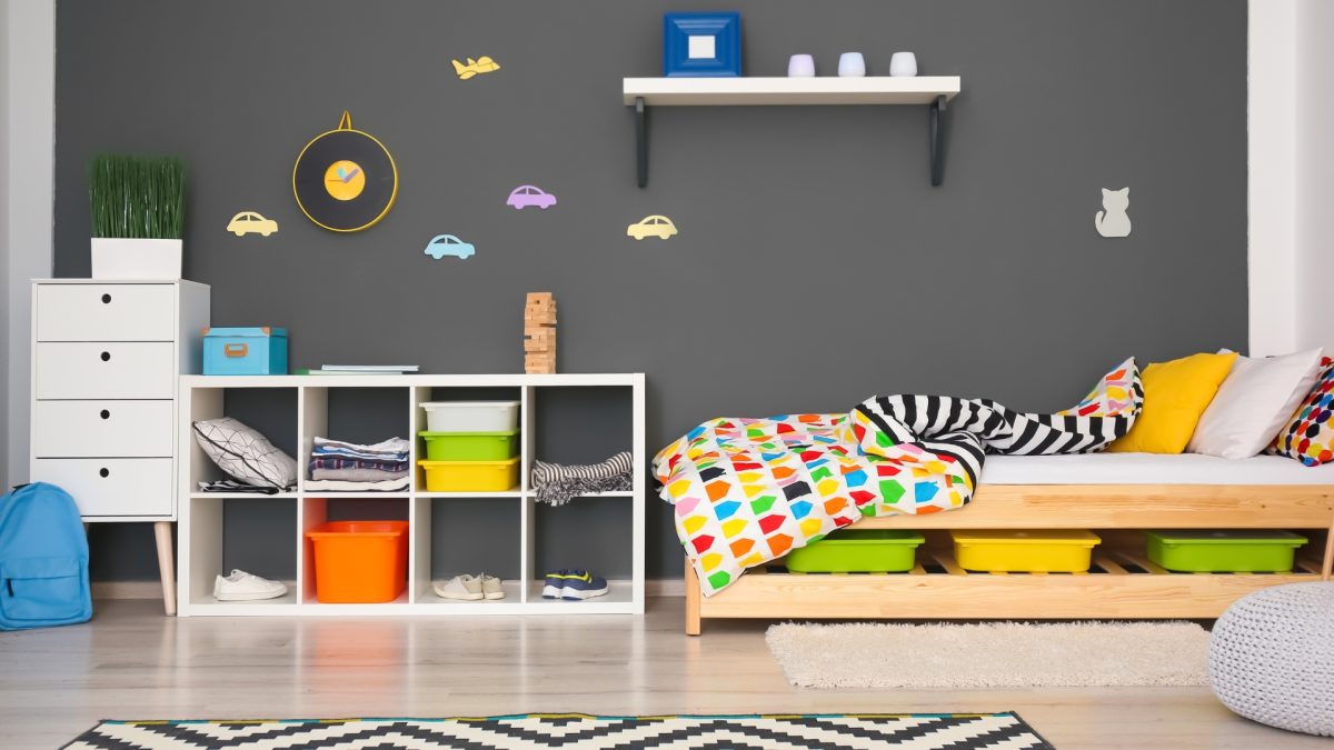 Colorful kids bedroom with themed decor and interactive play wal