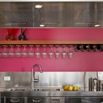 Modern kitchen with floating shelves and neatly styled dishware