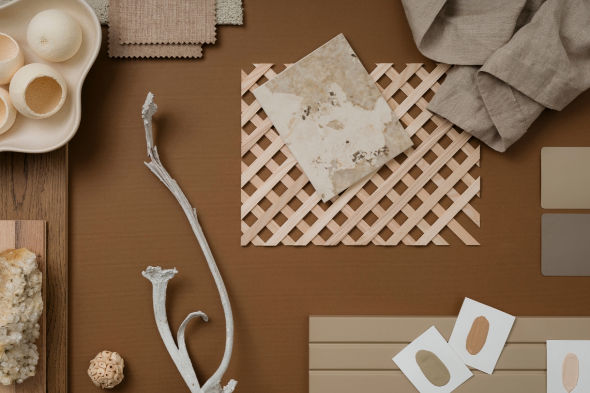 Earthy-toned living room with warm beige walls, wood furniture, and clay accent decor in 2026 style