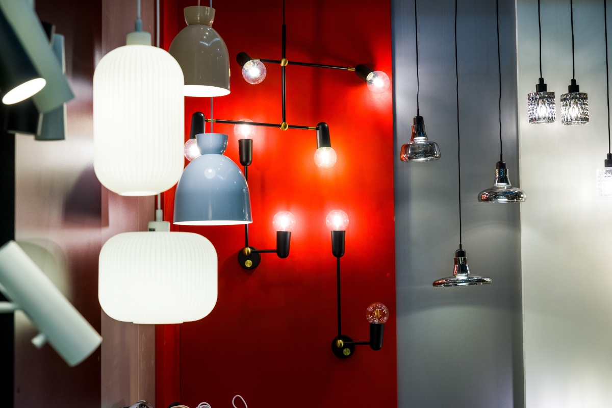 Layered wall highlighted with wall sconces creating depth and warmth in living room