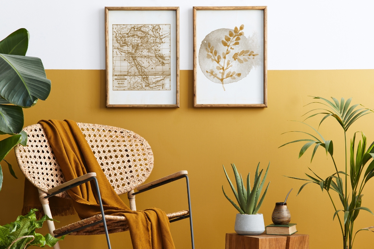 Living room styled with potted palms and summer greenery accents