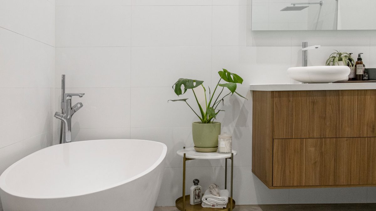 Modern bathroom with stone countertops and wood-look vanity for a stylish finish