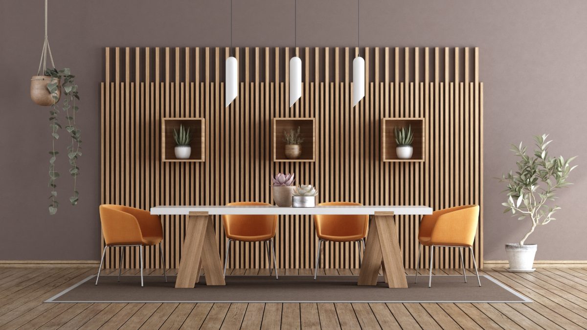 Minimal dining room with clean-lined wood table and modern upholstered chairs in neutral tones