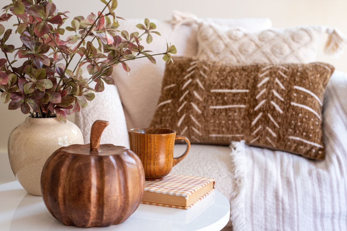 Living room styled with handcrafted pottery and artisan fall accents