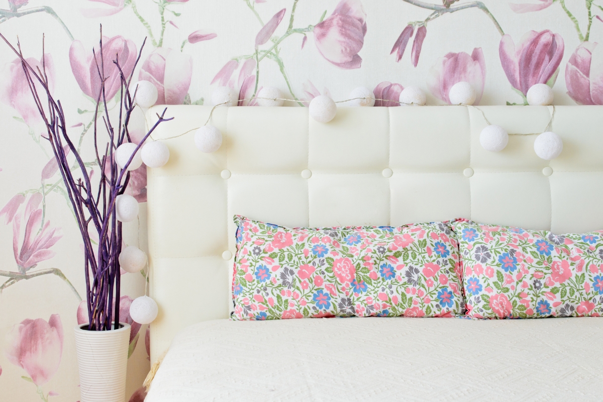 Living room styled with pastel pillows and spring floral arrangements